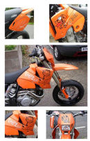 KTM SuperMoto dirt bike with a private commision of Garfield and Odie graphics.  The bike also has mirror finished chrome vinyl lettering for advertising applied to the side plastics under the seats.  The graphics were applied and covered with a protective layer finish to protect the graphics in off road conditions.